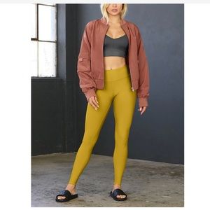 ALO Yoga High-Waist Mustard Leggings with Rust Bomber Styling